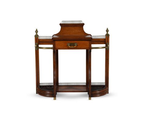 A VICTORIAN OAK AND BRASS MOUNTED HALL STAND ATTRIBUTED TO JAMES SHOOLBRED & CO, CIRCA 1883Headed by a baluster gallery above