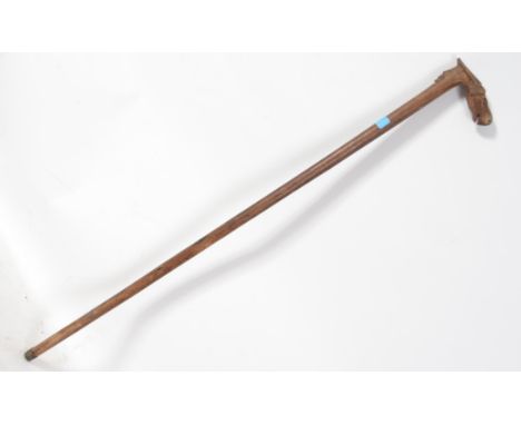 An unusual Greek walking stick dating to the 19th / 20th century with tapered stem with carved animal horse head handle
