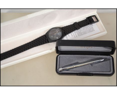 A vintage 20th century Fisher Space Pen complete in the original case together with a Deutsche Aerospace corporate issue wris