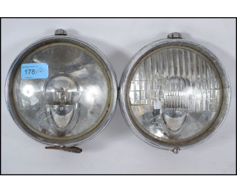 A pair of vintage Lucas classic car motoring M5 head lamps, one being a Lucas Ranger, the other being a Lucas Fogranger.