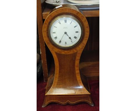An inlaid mahogany balloon shape mantel timepiece, the dial marked Speed, Kings Lynn, 30.5cm high and an oak-cased domed mant