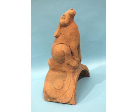A modern terracotta roof tile ridge finial depicting a hare, 17cm wide, 40cm high.