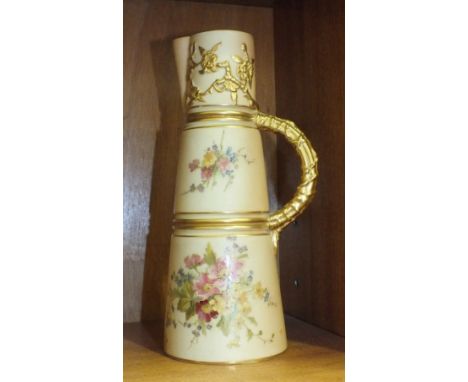 A Royal Worcester blush ivory tapering cylindrical jug, printed and painted with flowers in relief, with gilt foliage and ree