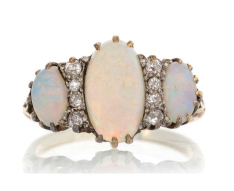 OPAL AND DIAMOND RING, set with three oval opals interspaced by diamond chips, indistinctly marked, size N 1/2Qty: 3.4g