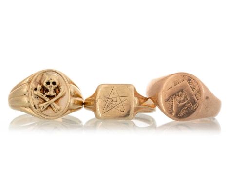 THREE SIGNET RINGS, IN NINE CARAT GOLD  two with Masonic emblems, the other decorated with a skull and crossbones in relief Q