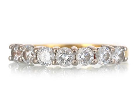 DIAMOND SEVEN STONE RING, set with round brilliant cut diamonds totalling approximately 1.20 carats, in eighteen carat gold, 