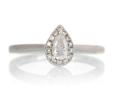 DIAMOND DRESS RING, set with a central pear shaped diamond within a round brilliant cut diamond halo, the diamonds totalling 