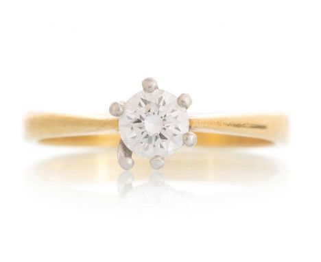 DIAMOND SOLITAIRE RING, IN EIGHTEEN CARAT GOLD set with a round brilliant cut stone of approximately 0.35 carats, size J 1/2Q