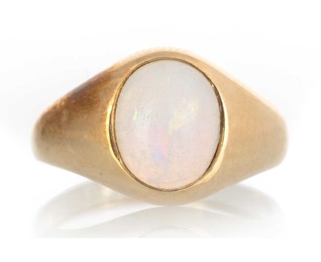 OPAL RING, set with an oval cabochon opal, in eighteen carat gold, size I 1/2Qty: 3.8g