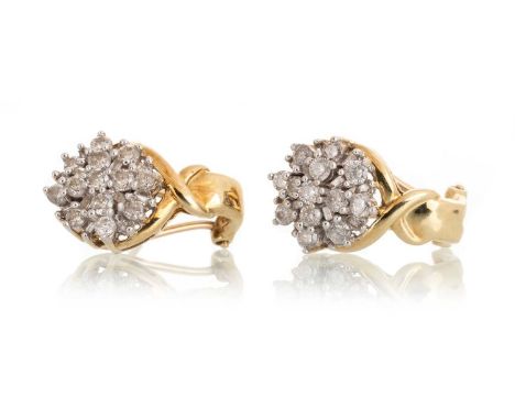 PAIR OF DIAMOND CLUSTER EARRINGS, IN TEN CARAT GOLD  each set with round and baguette cut stonesQty: 4.61g 