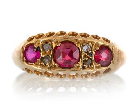 VICTORIAN RUBY AND DIAMOND BOAT SHAPED RING, set with three round rubies spaced by four small diamonds, in eighteen carat gol