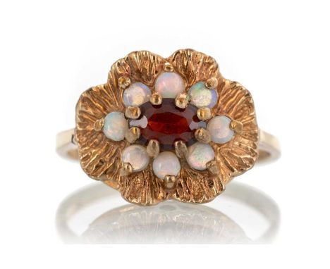 GARNET AND OPAL RING, IN NINE CARAT GOLD  of flower cluster form, size L 1/2Qty: 2.6g