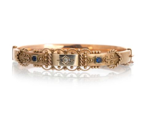 EARLY 20TH CENTURY SAPPHIRE AND DIAMOND BANGLE, IN NINE CARAT GOLD  set with three diamonds and two sapphires and with filigr