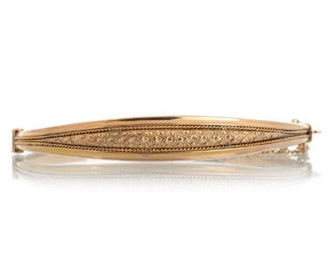 EDWARDIAN BANGLE, IN NINE CARAT GOLD  with central rows of twist designsQty: 6.4g