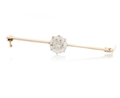 DIAMOND BAR BROOCH, the round brilliant cut stone on a platinum and gold knife edge bar, with IGI certificate stating the dia