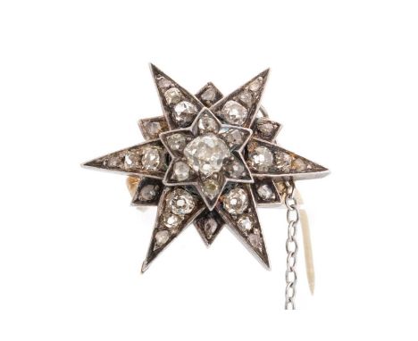 VICTORIAN DIAMOND STAR BROOCH, set with old cut diamonds totalling very approximately 1.40 carats, unmarked silver and gold28