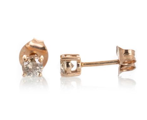 PAIR OF COGNAC DIAMOND STUD EARRINGS, the round brilliant cut diamonds totalling approximately 0.50 carats, in nine carat ros