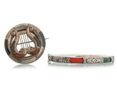 SCOTTISH AGATE BROOCH, with central lyre shaped instrument, unmarked, along with a white metal banglePorosity and splits to t