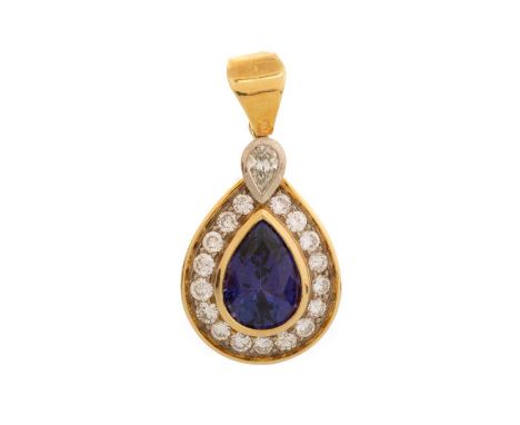 TANZANITE AND DIAMOND PENDANT, of teardrop form, set with a central tanzanite of approximately 5 carats, and surrounded by ei