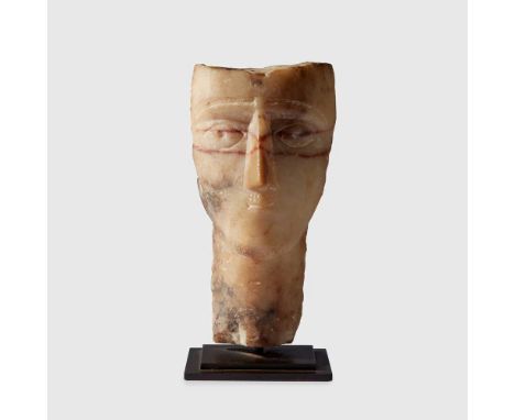 ANCIENT SABAEAN ARABIAN MALE HEAD SOUTHERN ARABIA, C. 1ST CENTURY B.C. carved striped alabaster, the slender neck rising to a