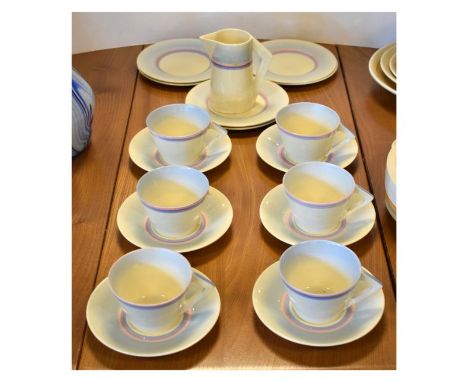 Clarice Cliff Newport Pottery Company tea ware having blue and puce banded decoration with Art Deco triangular handle  