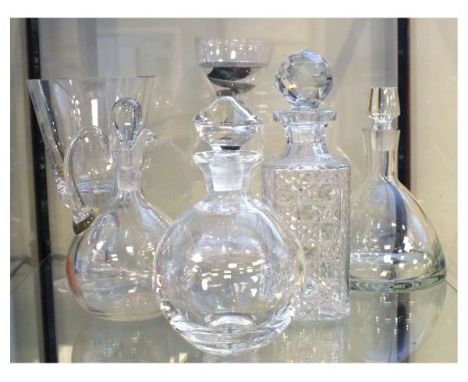Five various glass decanters together with an oversized wine glass standing 25cm high  