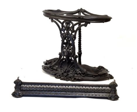 Good quality cast iron stick/umbrella stand, 65cm wide, together with a cast iron fire fender, 82cm wide (2)  