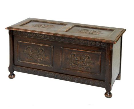 Early 20th Century oak coffer or bedding chest with two-panel hinged lid and front on bun feet, 106cm wide  