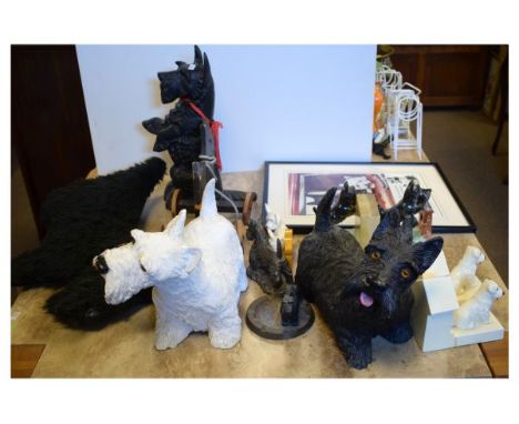 Group of items relating to Scotch Terrier (Scottie) dogs to include; cast iron door stop, ashtray, pairs of bookends, whisky 