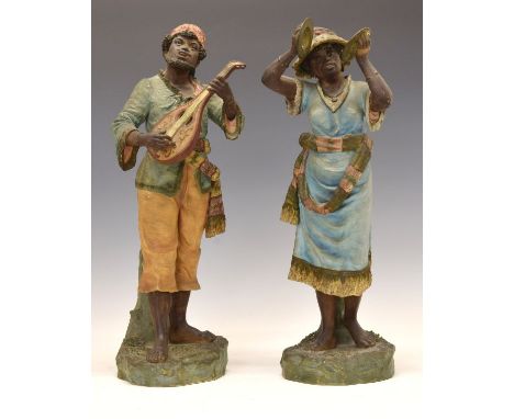 Pair of late 19th Century Continental terracotta figures, probably Austrian, each depicting street musician, he with a mandol