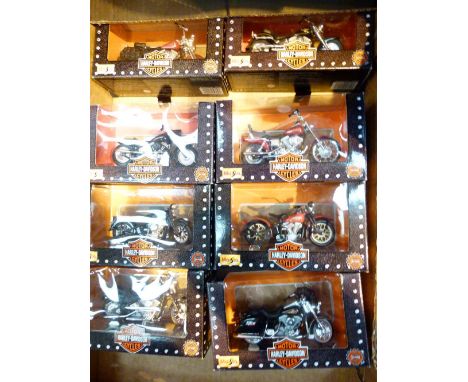 Eight boxed 1/18th scale Harley Davidson motorcycles, all different models