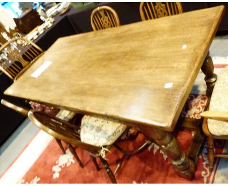 Large rectangular solid oak dining table on four turned legs made by Tudor Oak of Kent c1970
