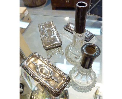 Five silver topped dressing table items