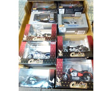 Nine boxed 1/18th scale motorcycles including Triumph, Honda and Kawasaki