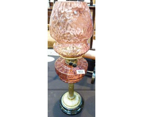 Cranberry glass lamp with brass fittings and a ceramic base. H: 67 cm