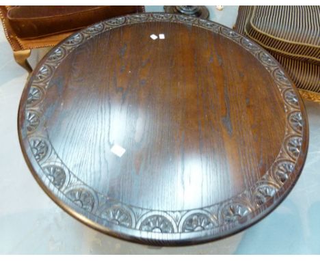 Large carved oak circular coffee table. D: 100 cm