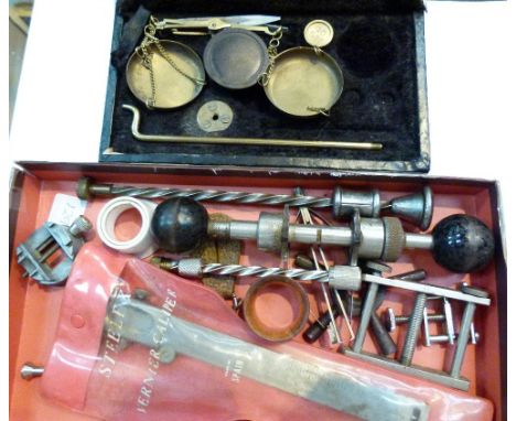 Box of watch makers tools and a boxed balance