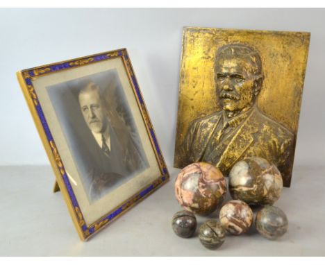 Small group of marble balls, including two name-place holders, an enamel bordered frame and a large cast metal portrait