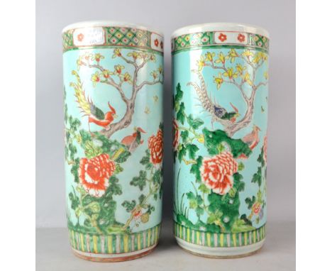 Pair of Chinese pottery stick stands painted in enamels