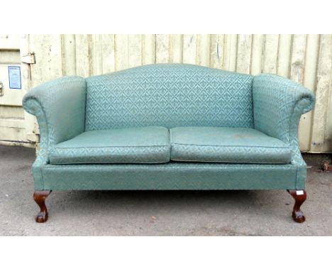 An early 20th century mahogany framed green upholstered sofa.