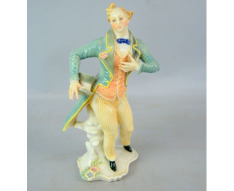 Karl Ens figurine of a gentleman in green coat holding a top hat, factory mark to base, 25cm. Provenance: part of The Stephen