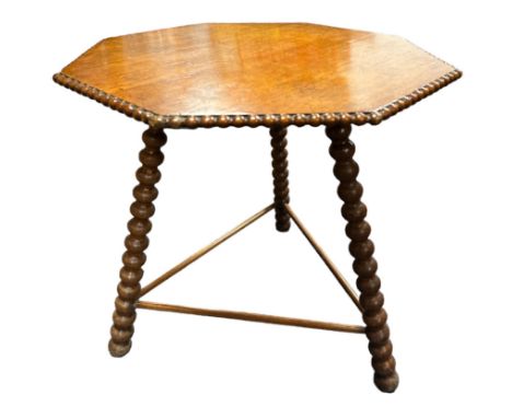 A late 19th century Gipsy table, the octagonal top with beaded edge over the bobbin turned supports H56cm, 54cm x 55cm.