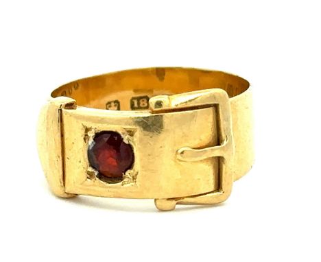 A hallmarked 18ct gold and red stone buckle ring, size M. Weight 5.8g. Please see the buyer's terms and conditions for purcha