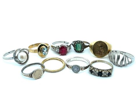 Ten hallmarked silver or stamped 925 rings, including a ruby set ring and a topaz set ring. 