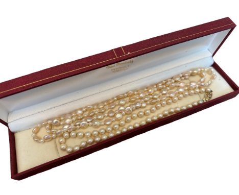 Two pearl necklaces - a cultured pearl necklace, 36cm, with 9ct gold clasp, and a pearl necklace with alternate larger flat a