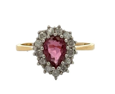A pear cut ruby and diamond cluster ring, hallmarked 18ct. Ruby 6.5mm x 5mm. Estimated diamond weight 0.39ct. Ring size J. To