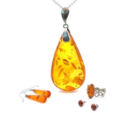 A collection of amber and 925 jewellery items. Comprises of a  large amber pendant on chain, length of pendant including bale