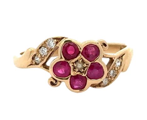A 9ct ruby and seed pearl flower ring with diamond set shoulders. Size P. Weight 2.43g. Birmingham hallmarks. Ring in very go