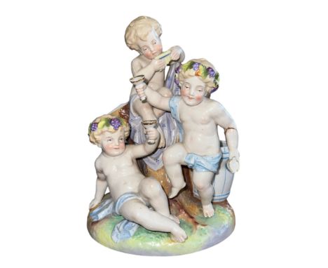 19th / 20th Century Allegorical Porcelain figural Putti group, toasting glasses and sat on a tree trunk. Pair of lower Putti 