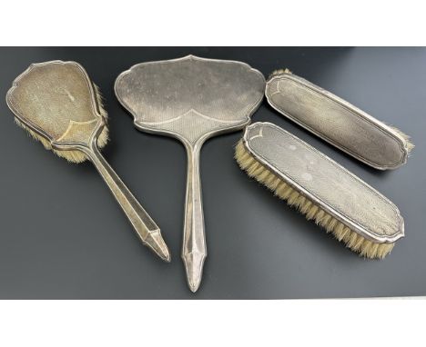 A set of matched Art Deco dressing table items by Samuel Levi. The items to include a mirror and three brushes, one sold AF. 